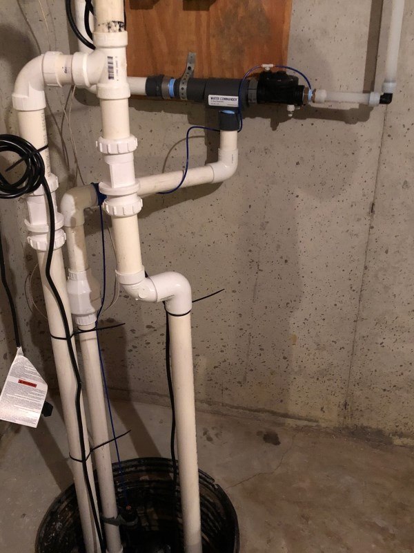 Water Commander water-powered sump pump and sump