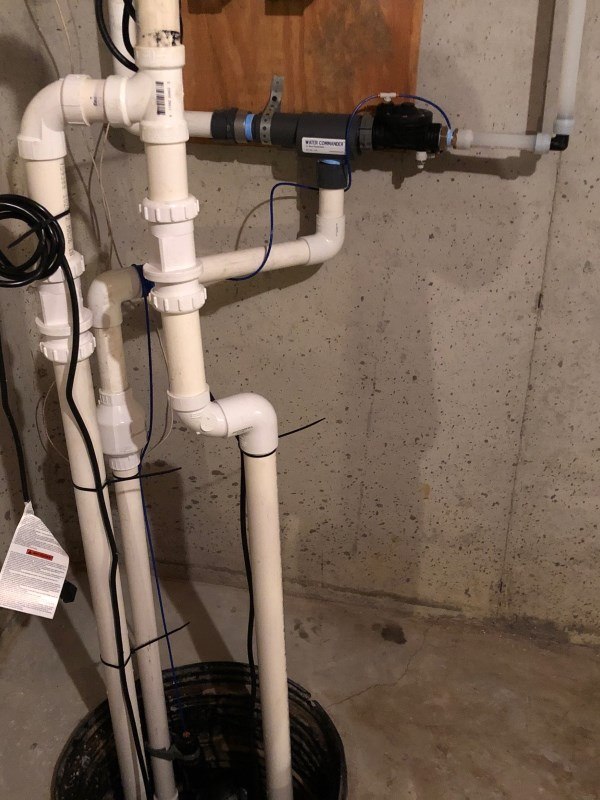 How does a water-powered sump pump work?